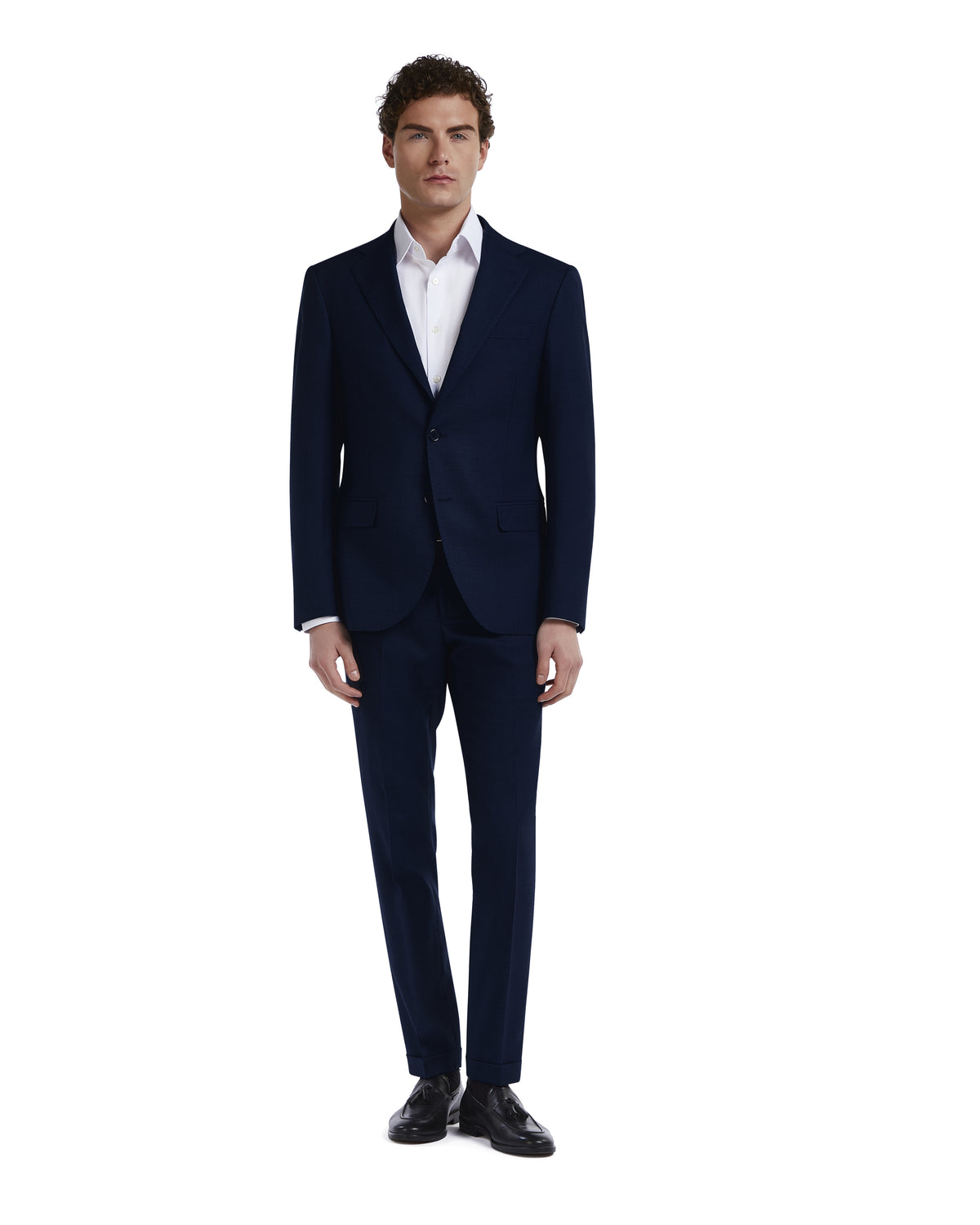 Navy blue tailored suit for men, made of premium materials, paired with a crisp white dress shirt.