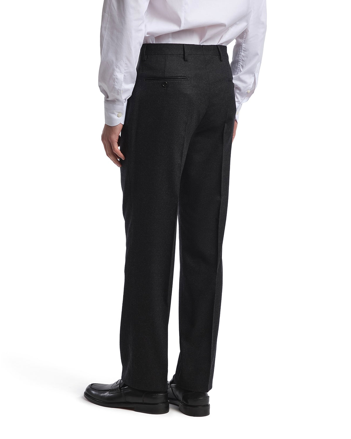 Men's black wool trousers with a tailored fit and single back pocket, styled for formal occasions.