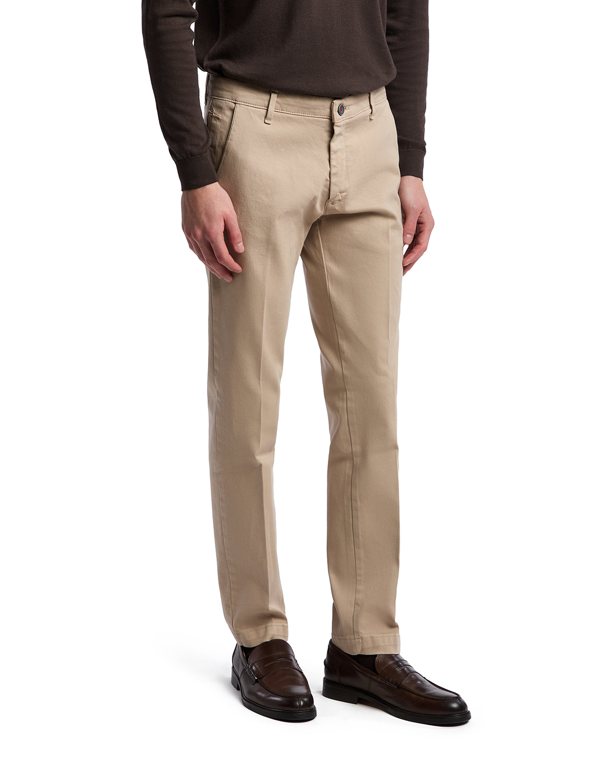 Beige cotton chinos for men, featuring a slim fit and versatile styling, paired with brown dress shoes.