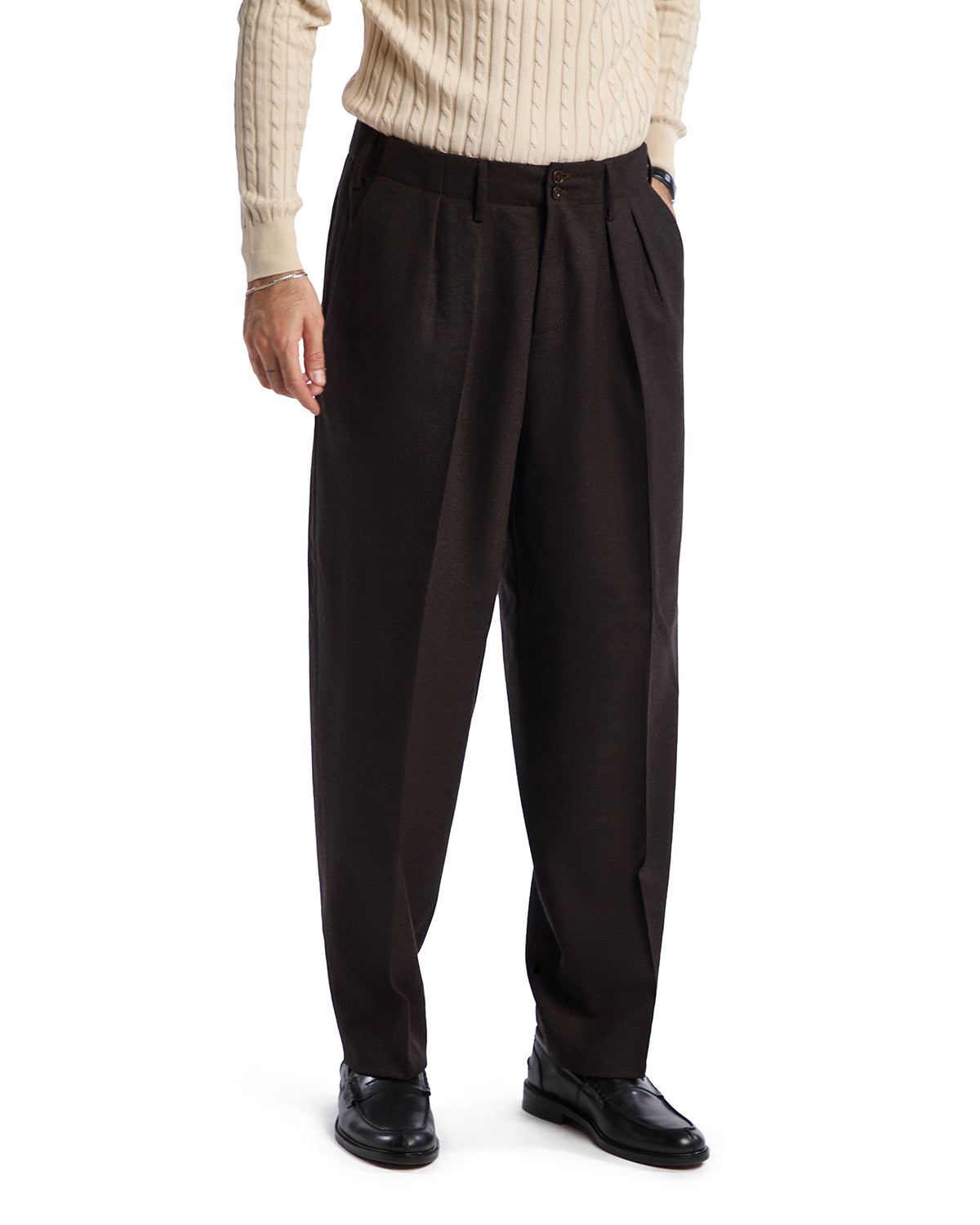 Men's brown pleated dress pants in soft fabric, styled for a relaxed fit, perfect for formal or casual occasions.