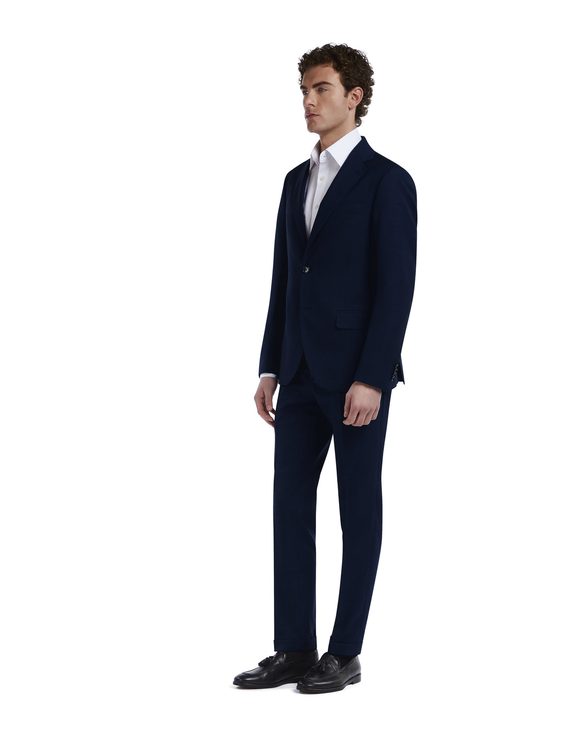 Men's slim-fit navy suit, tailored from premium wool, featuring a notched lapel and single-button closure.